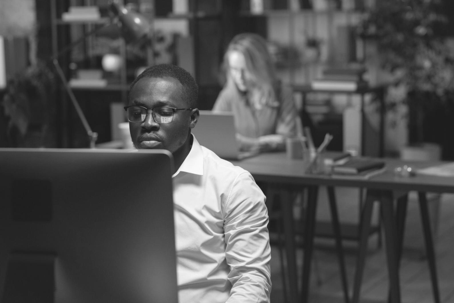 Professional reviewing financial documents and charts on a desk