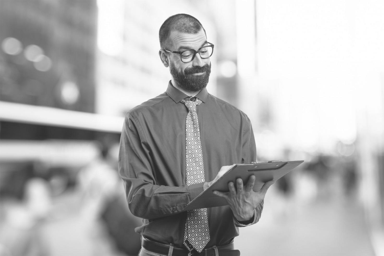 Professional presenting budget analysis techniques to engaged audience
